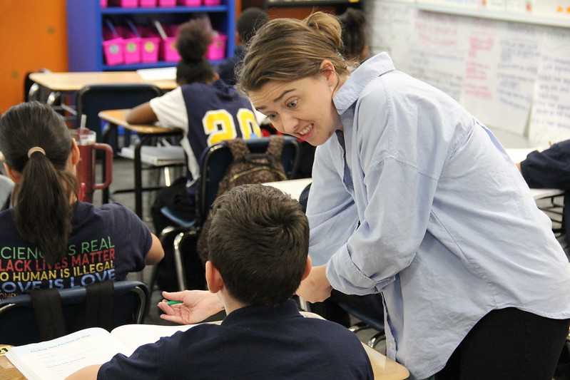 KIPP NE Denver Middle School math teacher Madeline Plachy helps one of her students.