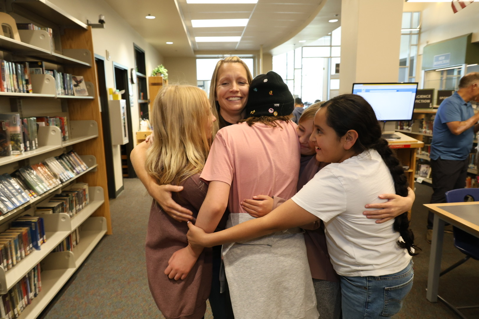 Ashley Smith gets hugs after learning she is a finalist to be 2025 Colorado Teacher of the Year