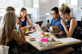 Professionals collaborating around a table