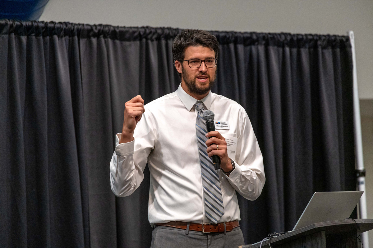 A man speaking at a podium