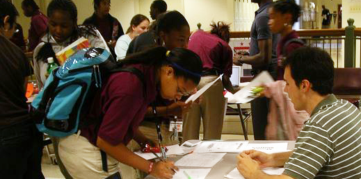 Student signing up for an activity at school